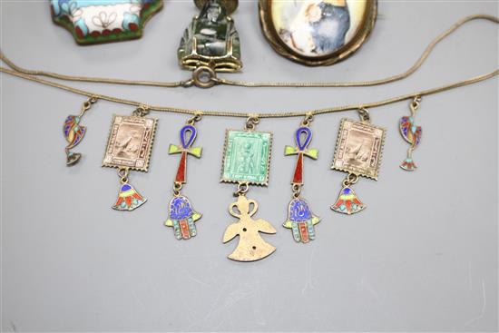 A white metal and enamel locket, a gilt metal and enamel necklace, two pendants, a brooch and 830 bug brooch, locket 24mm.